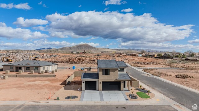 3377 W Palomar, Hurricane, UT 84737 - exterior space with stucco siding, driveway, fence, a mountain view, and an attached garage