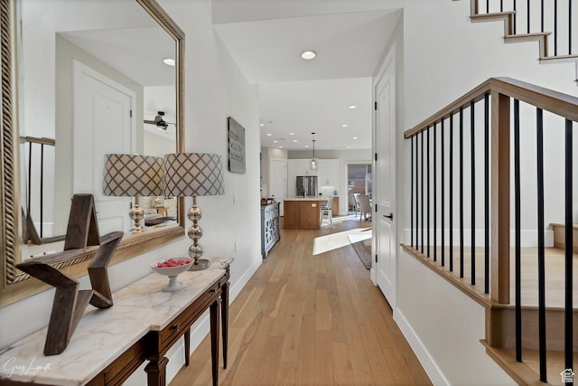 4755 S Purcell Dr, St George, UT 84790 - corridor with recessed lighting, baseboards, light wood finished floors, and stairs