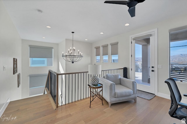 4755 S Purcell Dr, St George, UT 84790 - sitting room with an upstairs landing, baseboards, light wood-style floors, and recessed lighting
