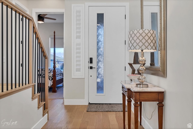 4755 S Purcell Dr, St George, UT 84790 - foyer featuring stairs, wood finished floors, ceiling fan, and baseboards