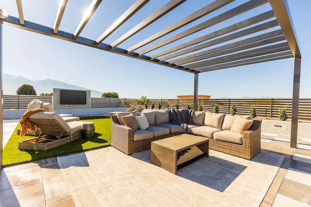 view of patio / terrace with a mountain view, fence, a pergola, and an outdoor hangout area