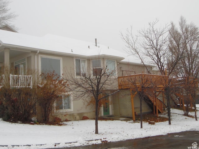 14028 S Candy Pull Dr, Draper, UT 84020 - snow covered rear of property featuring stucco siding and stairway