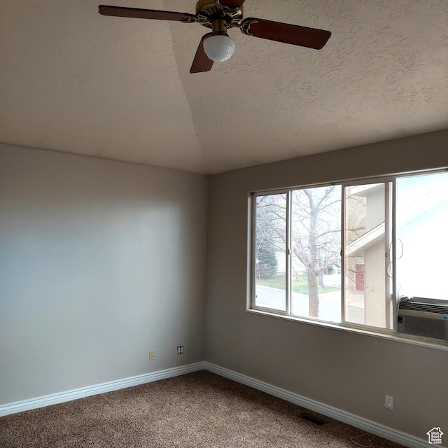 14028 S Candy Pull Dr, Draper, UT 84020 - carpeted empty room with vaulted ceiling, a ceiling fan, a textured ceiling, baseboards, and visible vents