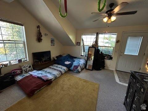 14028 S Candy Pull Dr, Draper, UT 84020 - carpeted bedroom featuring vaulted ceiling and a ceiling fan