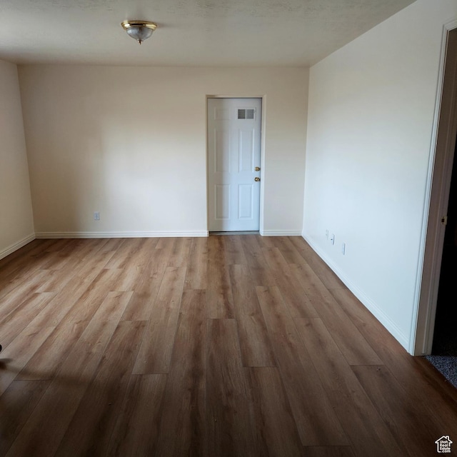 14028 S Candy Pull Dr, Draper, UT 84020 - spare room featuring baseboards, visible vents, and wood finished floors