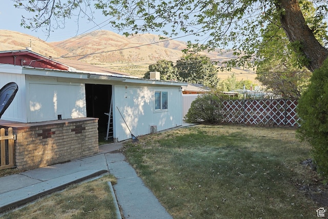 back of property featuring a mountain view