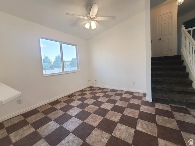 unfurnished room with a ceiling fan, stairs, baseboards, lofted ceiling, and visible vents