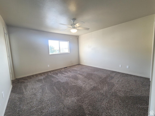 unfurnished room with baseboards, carpet flooring, and ceiling fan