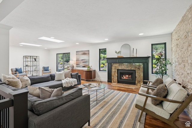 3041 Homestead Rd, Park City, UT 84098 - living room featuring a skylight, a premium fireplace, light wood-style floors, and recessed lighting