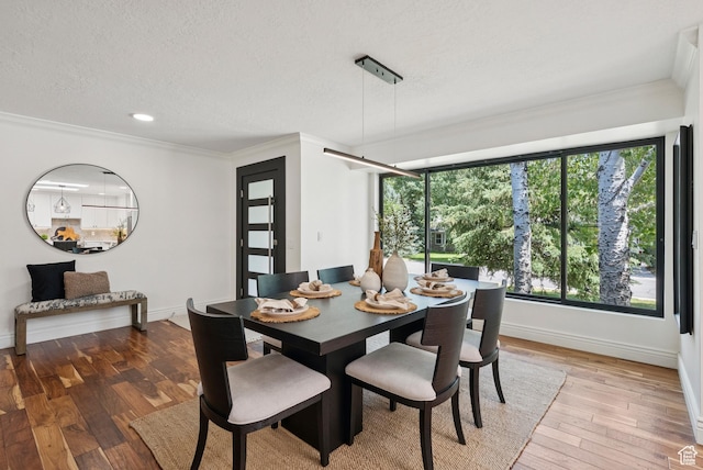 3041 Homestead Rd, Park City, UT 84098 - dining room with ornamental molding, light wood finished floors, a textured ceiling, and recessed lighting