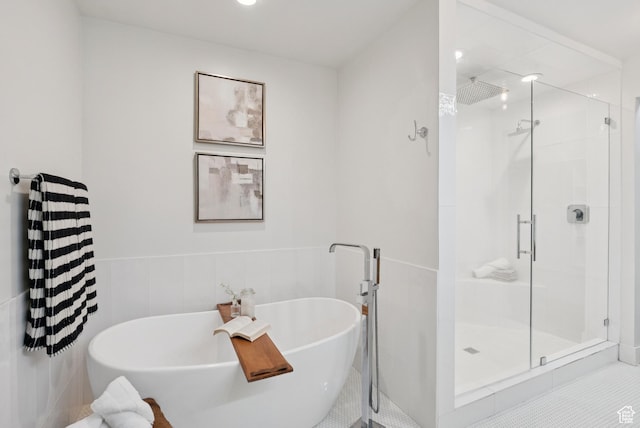3041 Homestead Rd, Park City, UT 84098 - bathroom with a shower stall, a freestanding tub, and a wainscoted wall