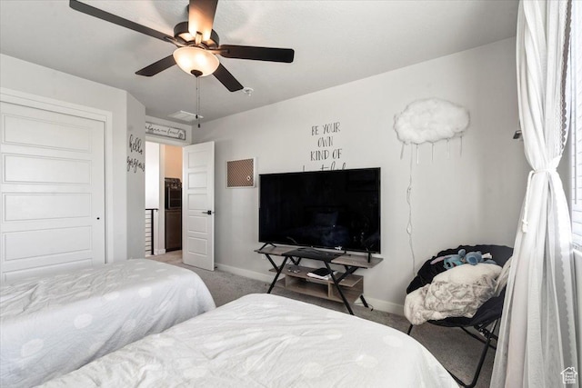bedroom with visible vents, baseboards, a ceiling fan, and carpet flooring