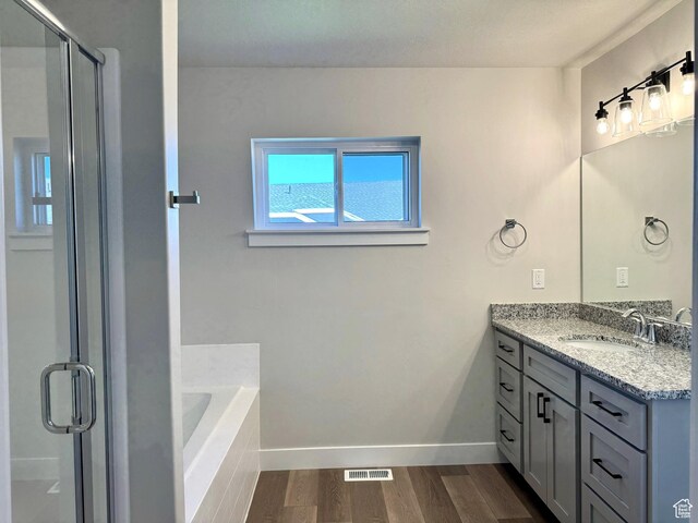 184 W Seasons Ln Unit 56, Garden City, UT 84028 - full bathroom with a bath, wood finished floors, vanity, and a shower stall
