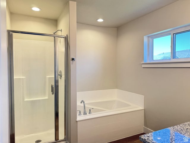 184 W Seasons Ln Unit 56, Garden City, UT 84028 - bathroom featuring recessed lighting, a bath, and a shower stall