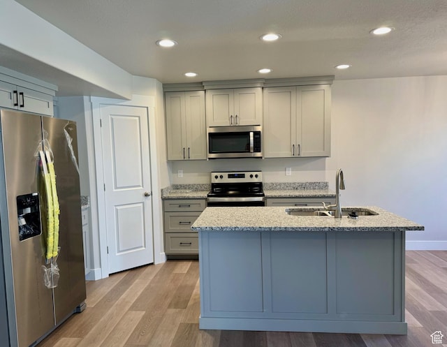 184 W Seasons Ln Unit 56, Garden City, UT 84028 - kitchen with light wood finished floors, gray cabinetry, a sink, and stainless steel appliances