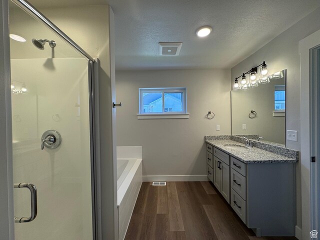 192 W Seasons Ln Unit 52, Garden City, UT 84028 - full bath featuring a stall shower, baseboards, wood finished floors, and a textured ceiling