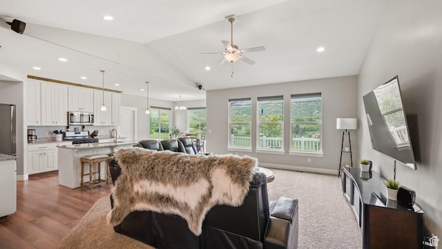 209 N Elk Ridge Dr, Elk Ridge, UT 84651 - living room with vaulted ceiling, a ceiling fan, recessed lighting, wood finished floors, and baseboards