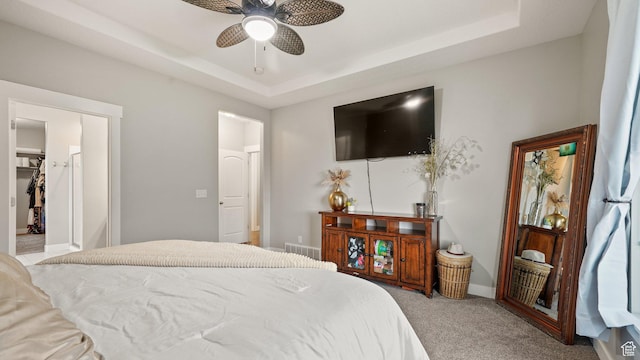 209 N Elk Ridge Dr, Elk Ridge, UT 84651 - carpeted bedroom featuring a tray ceiling, ceiling fan, and baseboards