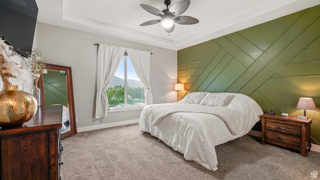 209 N Elk Ridge Dr, Elk Ridge, UT 84651 - carpeted bedroom with a mountain view, baseboards, a tray ceiling, and ceiling fan