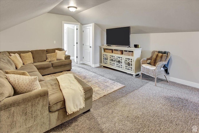 carpeted living room featuring vaulted ceiling and baseboards