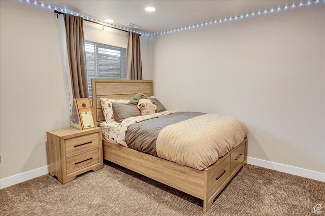 bedroom featuring light colored carpet, baseboards, and recessed lighting