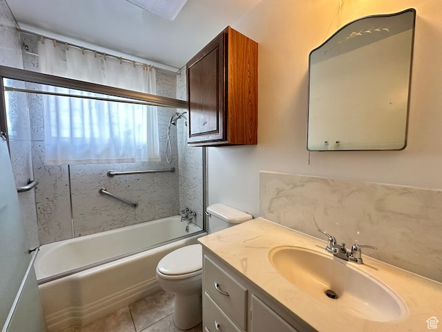 full bath with toilet, vanity, tile patterned floors, and shower / washtub combination