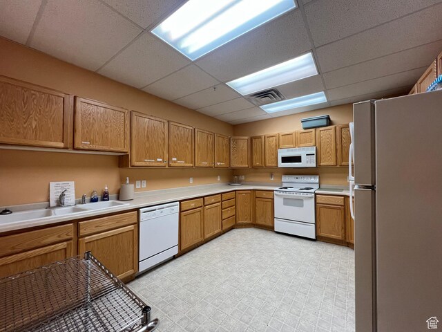 502 S 1040 E Unit 221, American Fork, UT 84003 - kitchen with a drop ceiling, white appliances, visible vents, a sink, and light countertops