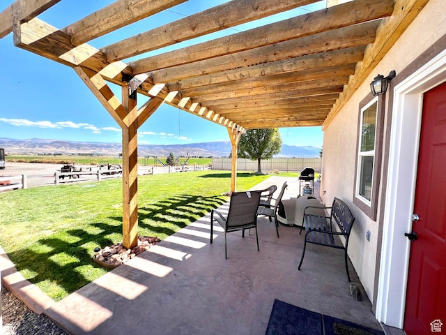 1942 N Sevier Valley Canal Rd, Richfield, UT 84701 - view of patio / terrace featuring a pergola, fence, and a mountain view