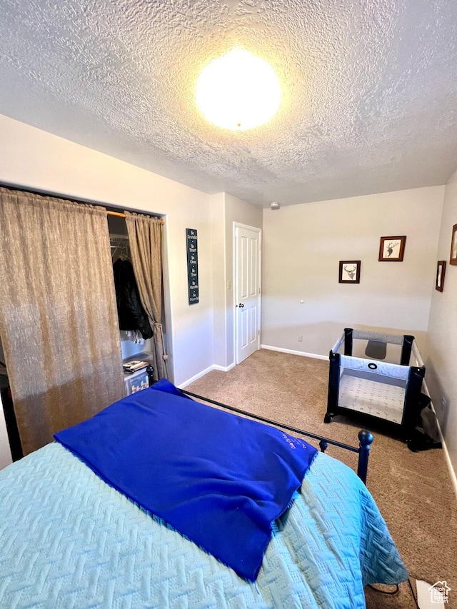 1942 N Sevier Valley Canal Rd, Richfield, UT 84701 - carpeted bedroom featuring a textured ceiling and baseboards