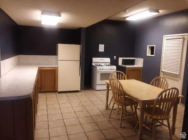 965 E 39th St S, South Ogden, UT 84403 - kitchen featuring white appliances and light countertops