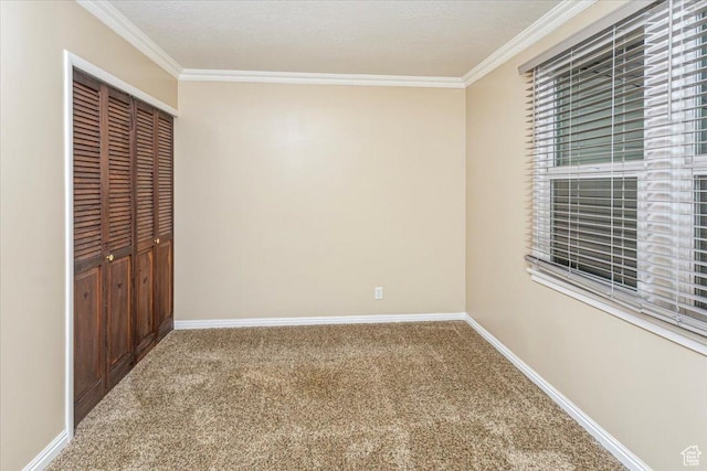 965 E 39th St S, South Ogden, UT 84403 - unfurnished bedroom featuring crown molding, carpet flooring, a closet, and baseboards