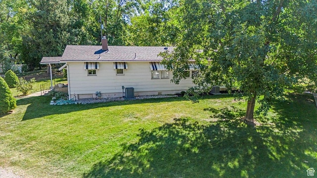 965 E 39th St S, South Ogden, UT 84403 - back of property with cooling unit, a lawn, and a chimney