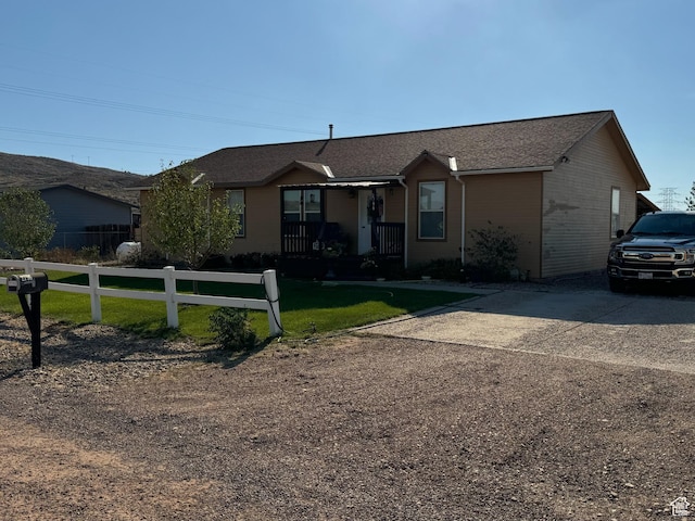 2796 S 2575 W, Roosevelt, UT 84066 - ranch-style home featuring covered porch, roof with shingles, and driveway