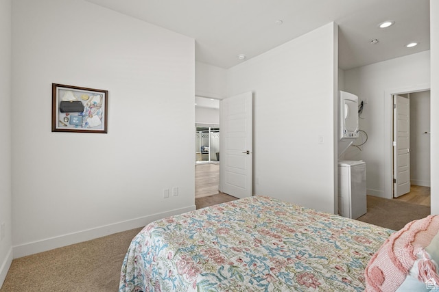 bedroom with recessed lighting, baseboards, and light carpet