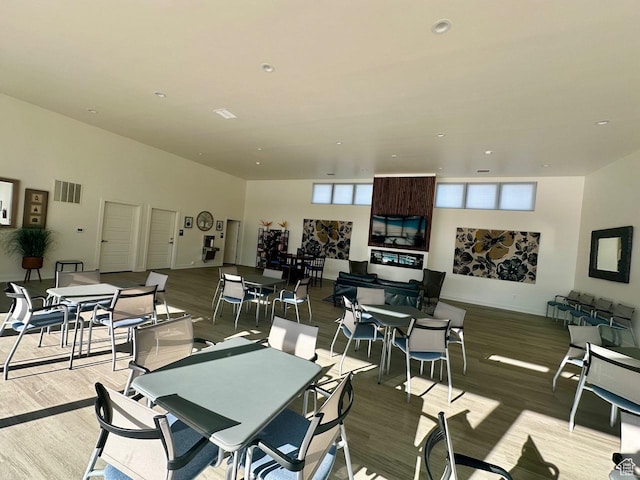 dining space featuring recessed lighting, visible vents, and wood finished floors