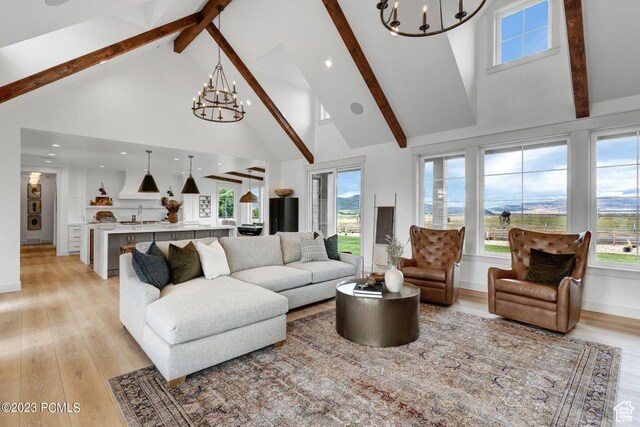 937 Hart Loop, Kamas, UT 84036 - living room with an inviting chandelier, light wood-type flooring, and high vaulted ceiling
