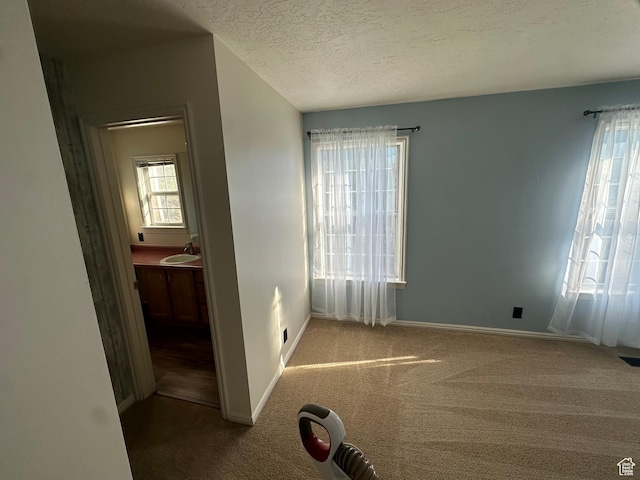 1988 E Gregson Ave, Millcreek, UT 84106 - unfurnished bedroom with carpet, baseboards, and a textured ceiling