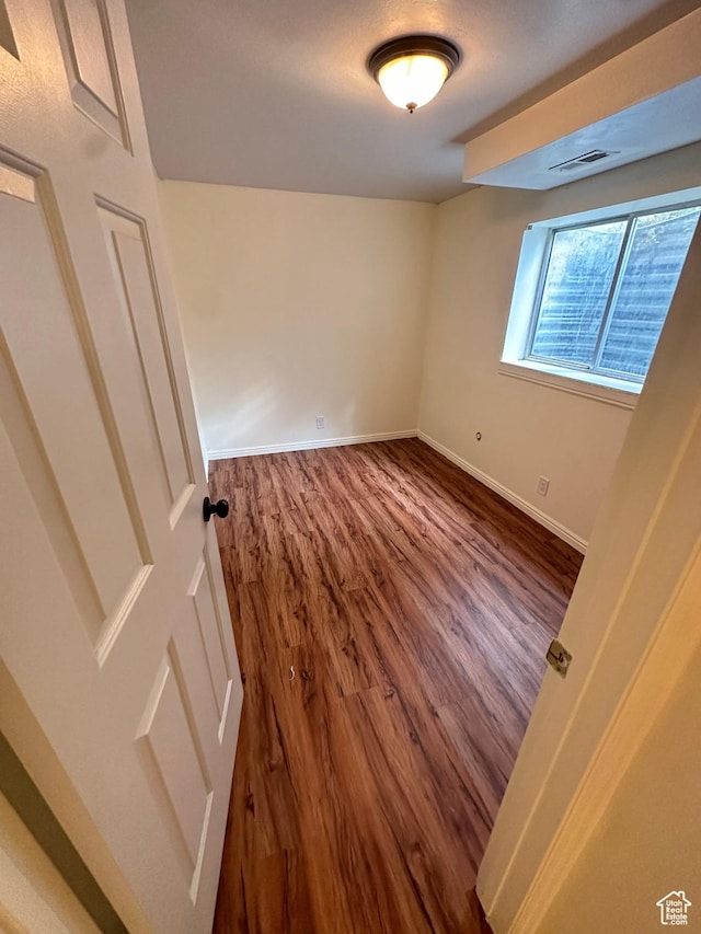 1988 E Gregson Ave, Millcreek, UT 84106 - spare room with wood finished floors and baseboards