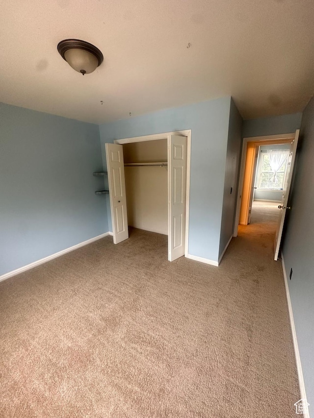 1988 E Gregson Ave, Millcreek, UT 84106 - unfurnished bedroom with carpet, baseboards, and a closet