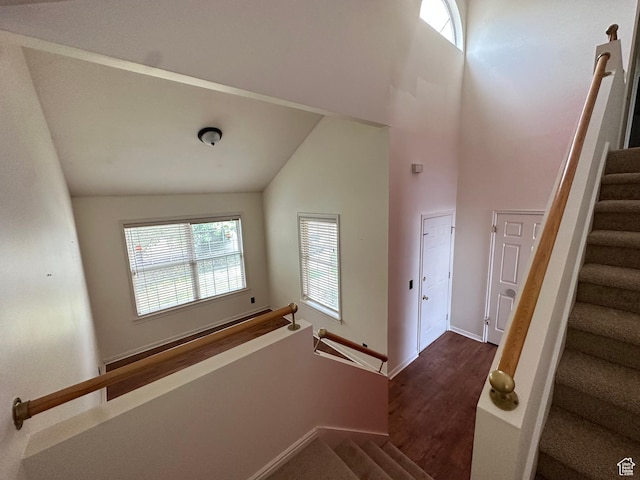 1988 E Gregson Ave, Millcreek, UT 84106 - staircase with wood finished floors, high vaulted ceiling, and baseboards