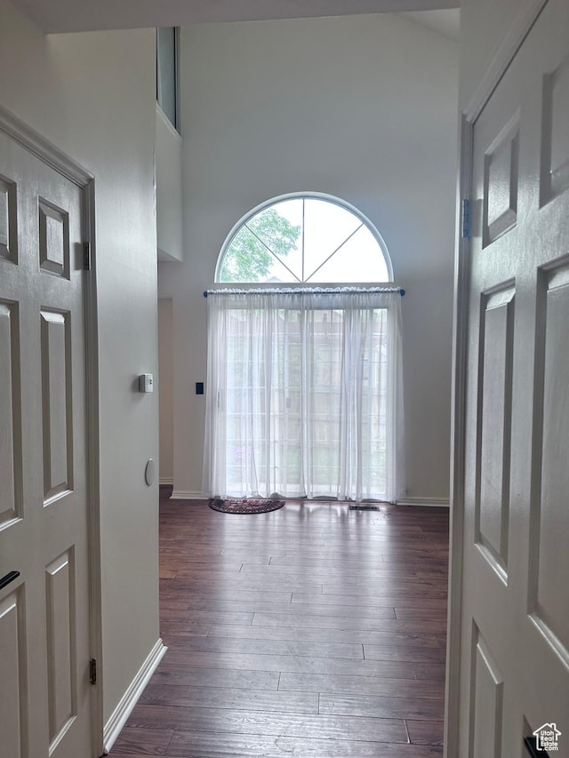 1988 E Gregson Ave, Millcreek, UT 84106 - hall with a high ceiling, hardwood / wood-style flooring, and baseboards