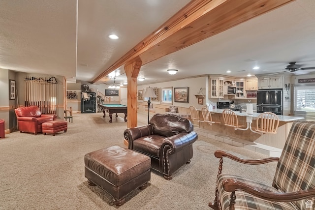1040 E Canyon Rd, Hyde Park, UT 84318 - carpeted living room featuring pool table, ornamental molding, and beam ceiling