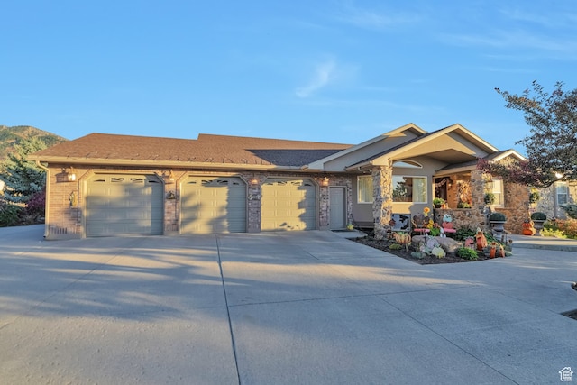 1040 E Canyon Rd, Hyde Park, UT 84318 - view of front of property with a mountain view and a garage