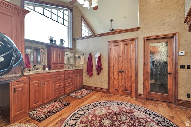 1040 E Canyon Rd, Hyde Park, UT 84318 - bathroom with ceiling fan, hardwood / wood-style flooring, and high vaulted ceiling