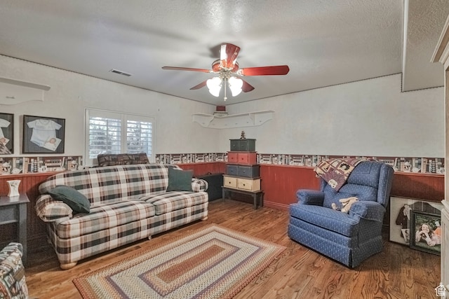 1040 E Canyon Rd, Hyde Park, UT 84318 - living room featuring wood-type flooring, ceiling fan, and a textured ceiling