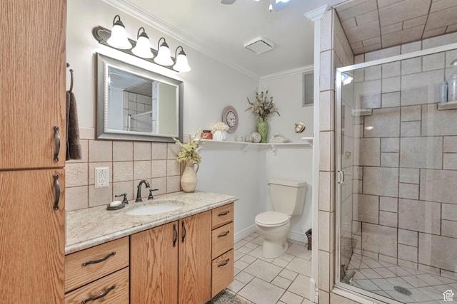 1040 E Canyon Rd, Hyde Park, UT 84318 - bathroom featuring vanity, backsplash, a shower with shower door, crown molding, and toilet