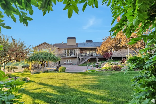 1040 E Canyon Rd, Hyde Park, UT 84318 - back of house with a yard