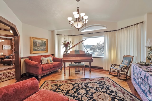 1040 E Canyon Rd, Hyde Park, UT 84318 - living room featuring light wood-type flooring and a chandelier