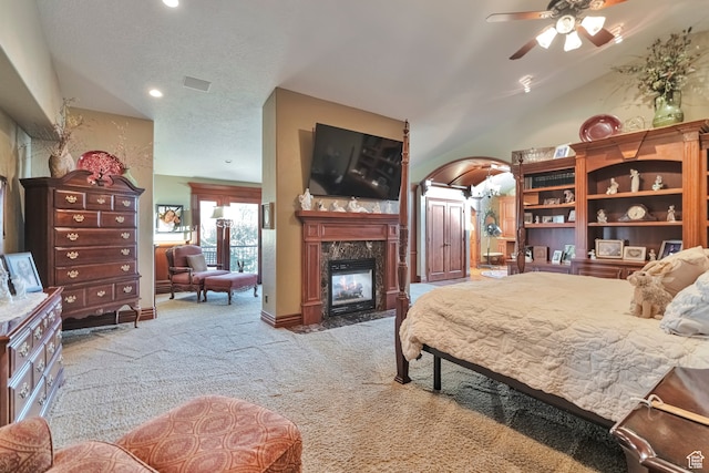 1040 E Canyon Rd, Hyde Park, UT 84318 - bedroom with ceiling fan, light colored carpet, a fireplace, and vaulted ceiling