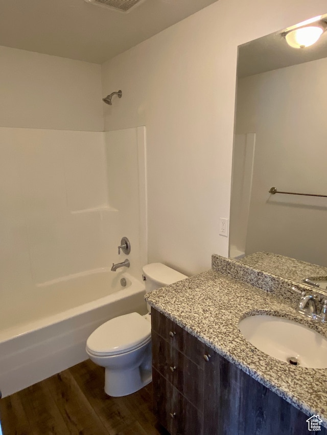 22 E Cedar Ln, Malad City, ID 83252 - full bathroom with shower / tub combination, vanity, toilet, and hardwood / wood-style flooring